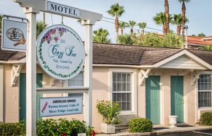 The Cozy Inn -- Entrance with Sign